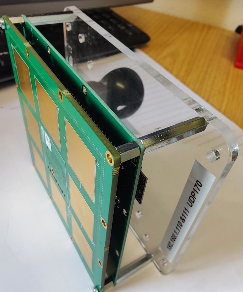 The Arcology 'TAG V1' Bluetooth positioning tag: a green PCB with two buttons, a USB-C connector, a programming header and a u-blox NINA-B406 Bluetooth module, used to track modular partition components.