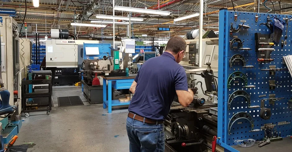 A technician machining a precision seal component on the shop floor at John Crane's Shannon manufacturing facility.